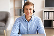 © Pixel-Shot - Young consultant of call center with headset working in office