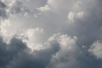 gray stormy sky with heavy clouds in sunlight