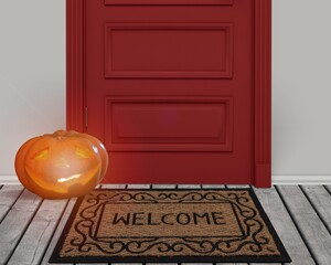 Wall Mural - smiling pumpkin, funny Halloween pumpkin on the doorstep.