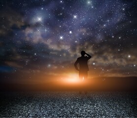 A man Exploring the night sky as the Milky Way galaxy background