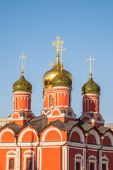 Domes of Church of St George the Victorious or Church of the Holy Great Martyr George on Pskov Mount on Varvarka street in Moscow and blue sky on background