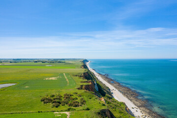 The Norman Cliffs at the edge of the green countryside in Europe, France, Normandy, towards Deauville, in summer, on a sunny day.