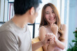 © chokniti - young man and woman couple in concept of romance love with a ring to surprise will you marry me