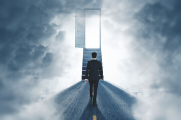 Wall Mural - back view of businessman walking towards open door and stairs in smoky room. success, way, direction
