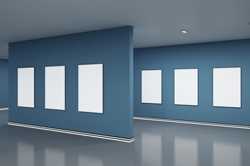 Wall Mural - Empty blue gallery interior with blank white mock up frames on wall and reflections on floor. Art, no people, museum and exhibition concept. 3D Rendering.