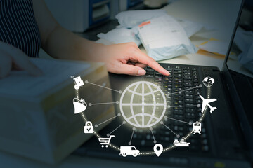 Businesswoman employing laptop for logistic network distribution and smart transportation, as well as networking intelligent logistics of container cargo ships, logistic import-export, and industry.