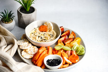 Hummus And Vegetables Crudites With Rice Crackers And Sunflower Seeds