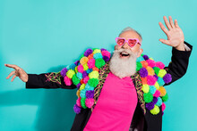 Photo Of Funny Excited Mature Guy Dressed Craft Pom-pom Jacket Eyewear Smiling Dancing Isolated Turquoise Color Background