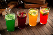 Various assorted glasses of different fruit lemonades