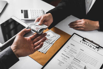 Wall Mural - Businessmen or politicians agree to accept bribes given in envelopes. To do illegal business, corruption in the contracting business, corruption concept and bribery.