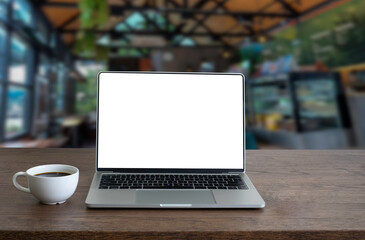 front view of open laptop computer notebook with blank monitor white screen display on work table de