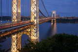 The illuminated George Washington Bridge spanning the Hudson River in evening. New York City, Upper Manhattan. USA