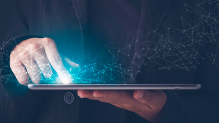 Wireless communication, High speed internet, Connecting network around the world with technology concept. Finger touches tablet screen and blue light with a virtual digital connection line.