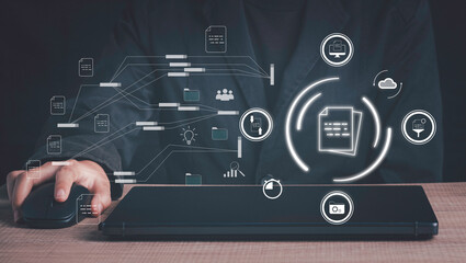 Document management, Database directory, E-document, Paperless office concept. Hand used laptop show document virtual icon and connecting line database process automation to efficiently manage file.