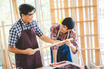 Wall Mural - wooden workshop concept, carpenter team craftsman person working with a wood work construction tool