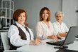 © Alexandr - portrait of three successful business women at the table with laptops