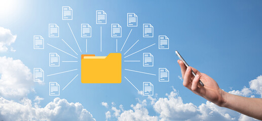 Document Management System DMS .Businessman hold folder and document icon.Software for archiving, searching and managing corporate files and information.Internet Technology Concept.Digital security.