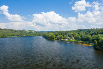 The Lac des Settons and its campsites in the forest in Europe, France, Burgundy, Nievre, Morvan, in summer, on a sunny day.