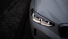 Detail Close Up View Of The LED Adaptive Head Light Of Premium Luxury Sedan Car. Automotive Headlight Lighting Technology Detail.