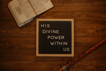 Black Letterboard with bible and sword Christian quote 
