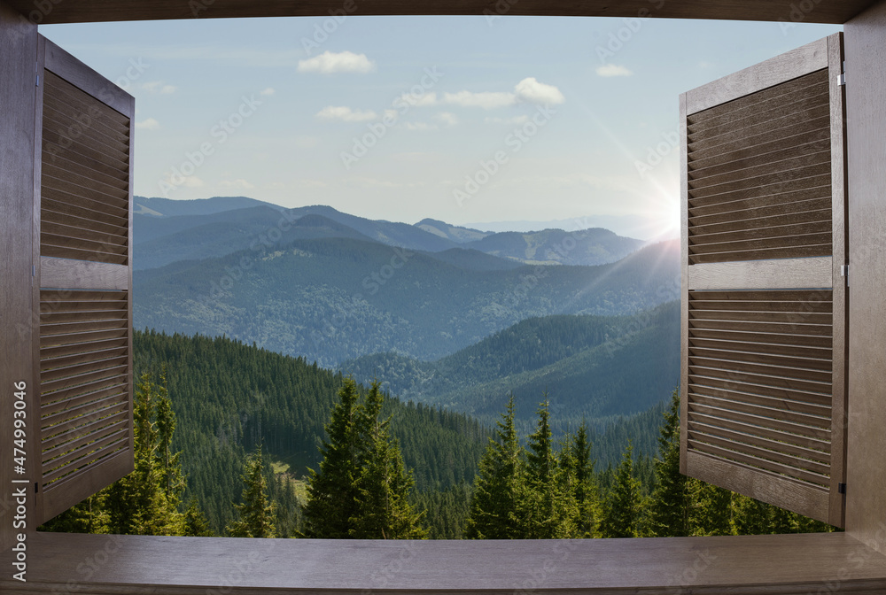 Window view of a mountains. Landscape. Sunny Day. Hotel room in the ...