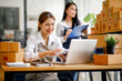 © David - Two Asian young woman working together for SME project. Young Owner people startup for Business Online, SME, Delivery Project. Online Business and  Small business Concept
