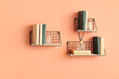 Modern shelves with books and decor on color wall
