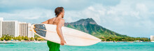 Surfer Man Going Surfing On Waikiki Beach In Ocean Waves Carrying Surfboard. Summer Fun Watersport Active Lifestyle Banner Panoramic.