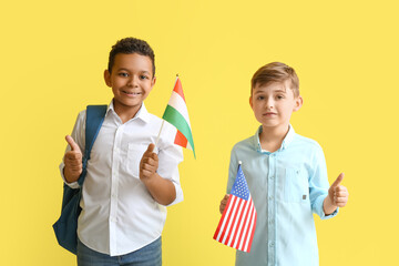 Wall Mural - Pupils of language school with different flags on color background