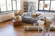 © Syda Productions - moving and real estate concept - boxes with stuff at new home