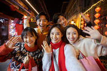 Happy Young Friends Shopping For Chinese New Year