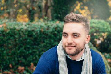 portrait of young blond man with short hair and beard