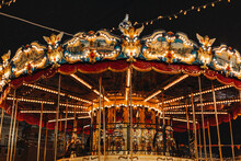Shiny Golden Children's Magic Carousel With Horses Merry-go-roundi N The Evening Lights