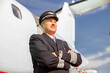 © Kostiantyn - Man airplane pilot standing outdoors at airport