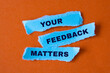 YOUR FEEDBACK MATTERS - text on torn paper.