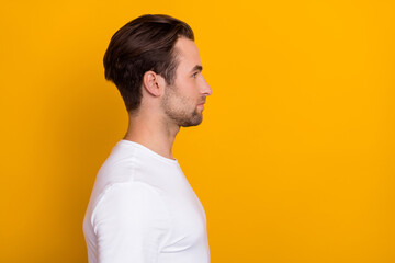 Sticker - Profile photo of calm focused young man look empty space blank isolated on yellow color background