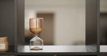 Sand Is Flowing Through Hourglass