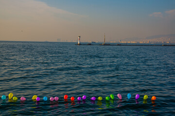 Wall Mural - IZMIR, TURKEY: Landscape with sea view and lighthouse in Izmir.