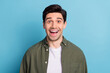 © deagreez - Portrait of astonished guy hear wonderful message scream open mouth isolated on blue color background