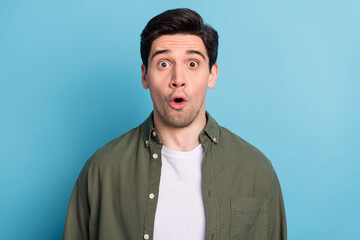 Wall Mural - Portrait of impressed guy look open mouth amazing message isolated over sky light color background