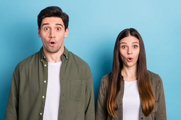 Sticker - Photo of attractive shocked young lady guy wear green shirts big eyes isolated blue color background