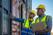African Workers, Engineer, Technician Holding Laptop For Checking And Inspecting On Site Containers Area For Shipping Transportation. Foreman Control Industrial Container Cargo Freight Ship.