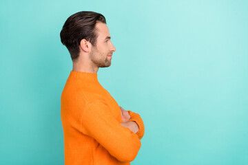 Sticker - Profile side photo of young man crossed hands look empty space smart isolated over teal color background