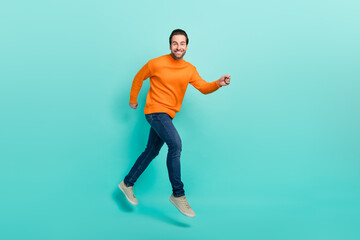 Wall Mural - Full size profile photo of cheerful excited man toothy smile look camera isolated on turquoise color background