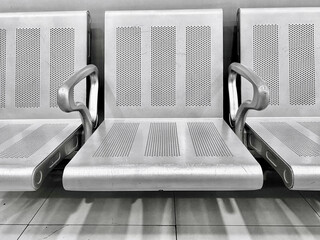 Wall Mural - Empty metal chairs in the shopping mall for customers to rest