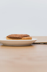 Sticker - white plate with delicious organic vegan almond pie on a wooden tabletop