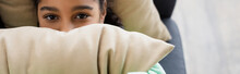 Top View Of African American Girl In Bad Mood Looking At Camera While Covering Face With Pillow, Banner