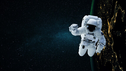 Wall Mural - space man astronaut flying in space with stars and night planet earth.