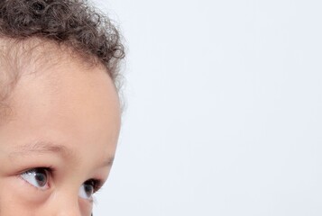 Wall Mural - Little boy looking with white background stock photo 