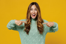 Young Amazed Surprised Exultant Fun Caucasian Woman 30s Wearing Green Knitted Sweater Point Index Finger On Herself Isolated On Plain Yellow Color Background Studio Portrait. People Lifestyle Concept.